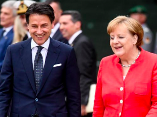 Merkel a Roma: contraddice Macron sulla Nato e dice sì all’Unione bancaria 